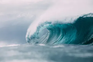 white and blue ocean waves by Matt Paul Catalano courtesy of Unsplash.