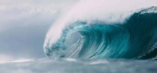 white and blue ocean waves by Matt Paul Catalano courtesy of Unsplash.